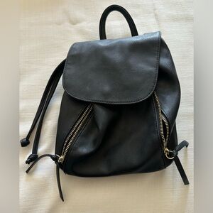 Black faux leather backpack purse.